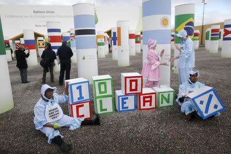 Adults dressed as babies from Avaaz, a global civic organization that promotes activism on issues such as climate change, wear bibs with the messages, "Where are the Grown Ups?" at a protest the behaviour by negotiators at the World Climate Change Conference 2015 (COP21) at Le Bourget, near Paris, France, December 4, 2015. REUTERS/Stephane Mahe