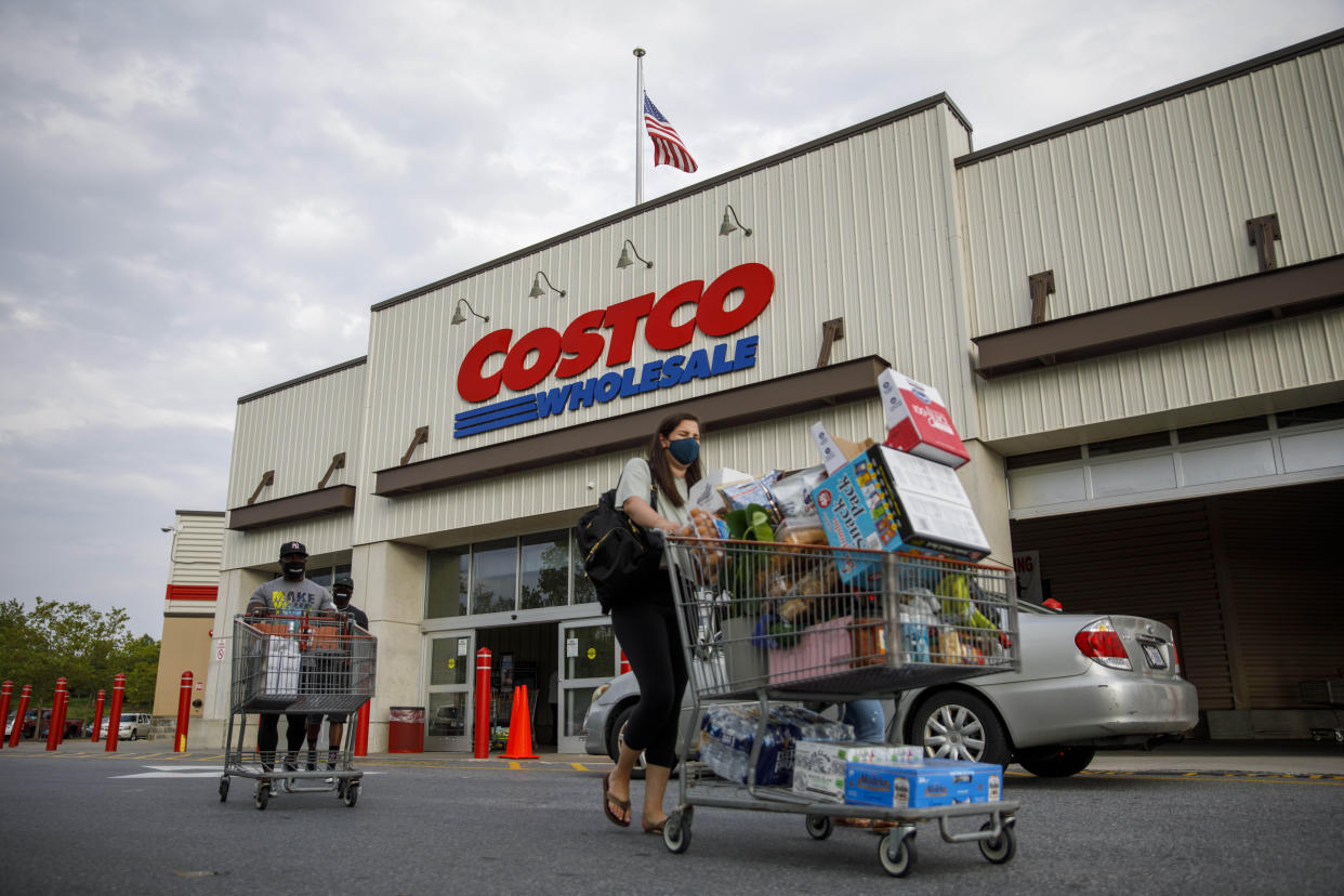 WASHINGTON, D.C., Aug. 15, 2020 -- Shoppers wearing face masks leave a Costco wholesale store in Washington, D.C., the United States, Aug. 14, 2020. A new ensemble forecast published by the U.S. Centers for Disease Control and Prevention has projected up to 200,000 total COVID-19 deaths in the U.S. by Sept. 5. (Photo by Ting Shen/Xinhua via Getty) (Xinhua/ via Getty Images)