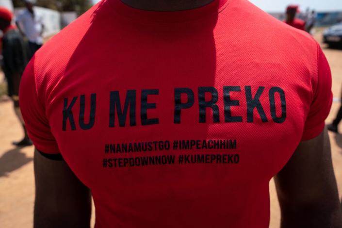 A demonstrator wears a &quot;Ku Me Preko&quot; t-shirt during the &quot;Ku Me Preko&quot; demonstration on November 5, 2022 in Accra, Ghana. People took to the streets of Ghana's capital to protest against the soaring cost of living, aggravated since the Russian invasion of Ukraine.