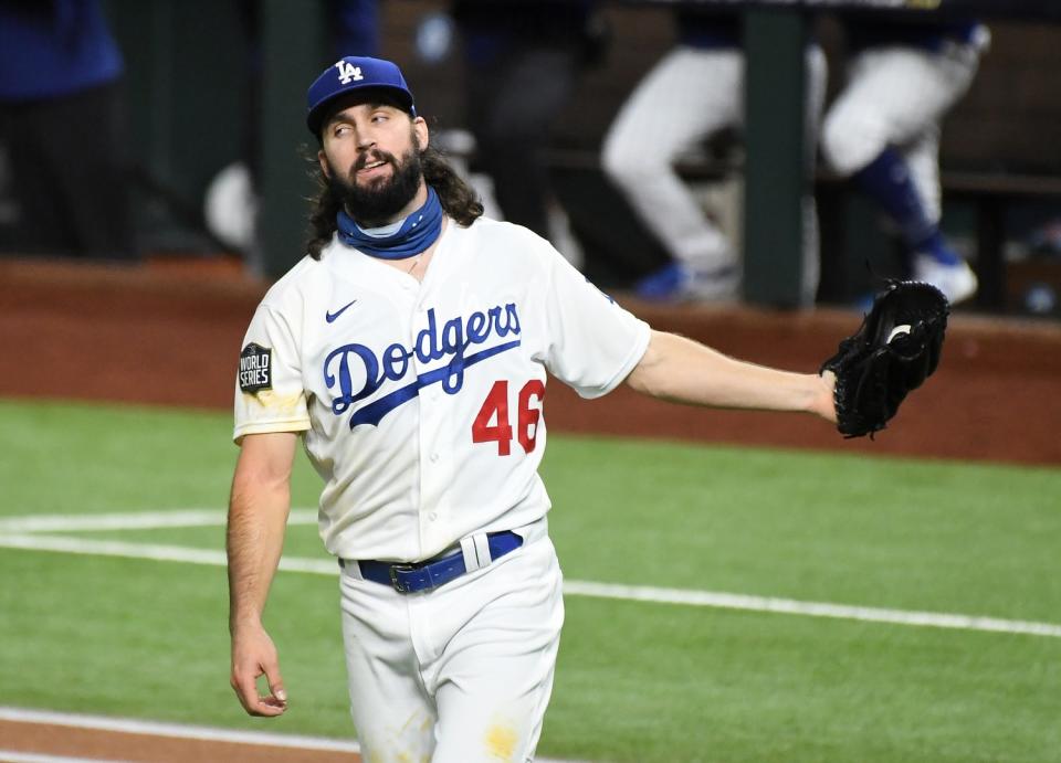 Dodgers starting pitcher Tony Gonsolin walks back to mound after giving up a solo home run.