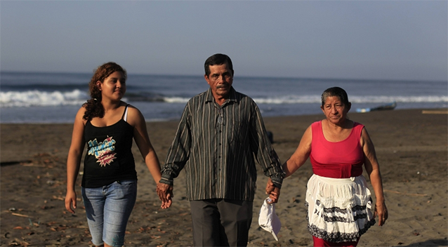 The family of castaway fisherman Jose Salvador Alvarenga — (left-right) his sister Fatima Orellana, father Jose Ricardo, and mother Maria Julia Alvarenga — pose for a picture in their fishing hometown. Photo: Reuters.