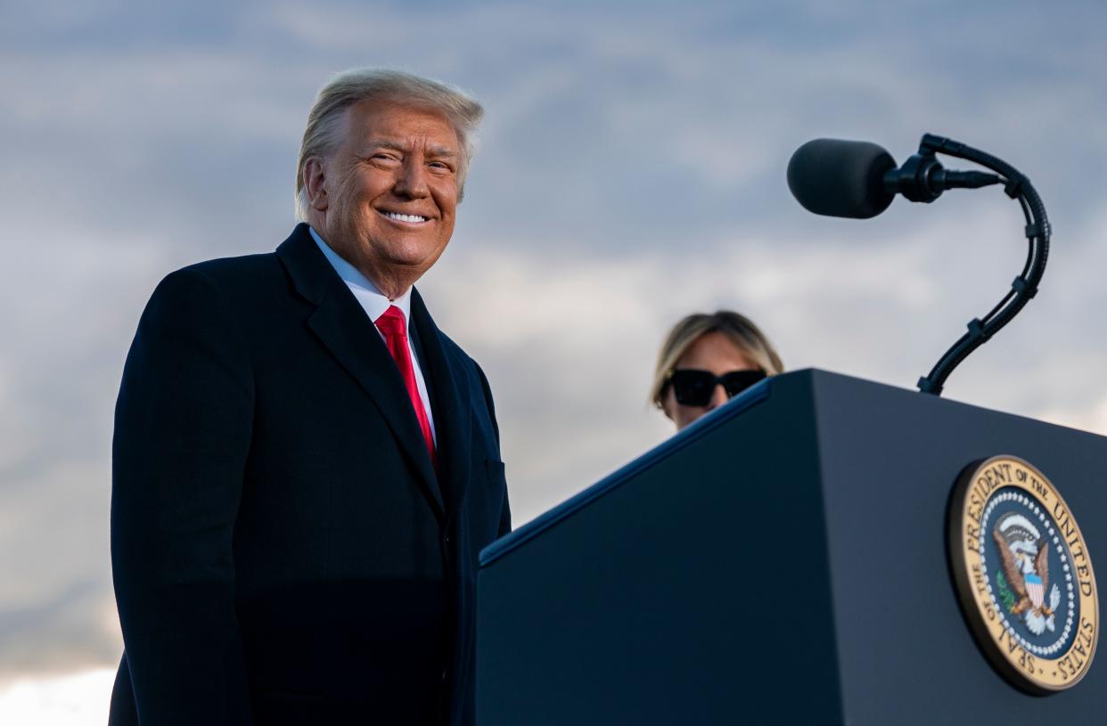 Outgoing US President Donald Trump and First Lady Melania Trump address guests at Joint Base Andrews in Maryland on January 20, 2021. (Alex Edelman/AFP via Getty Images)