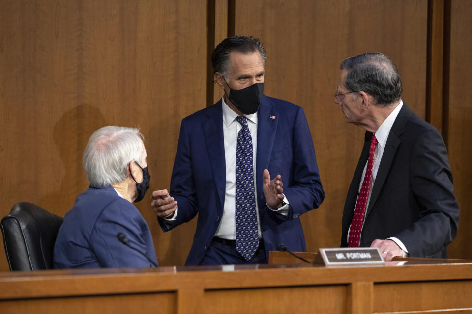 From left, Sen. Rob Portman, R-Ohio, Sen. Mitt Romney, R-Utah, and Sen. John Barrasso, R-Wyo., speak before a Senate Foreign Relations Committee meeting on Capitol Hill in Washington, Wednesday, Aug. 4, 2021. (AP Photo/Amanda Andrade-Rhoades)