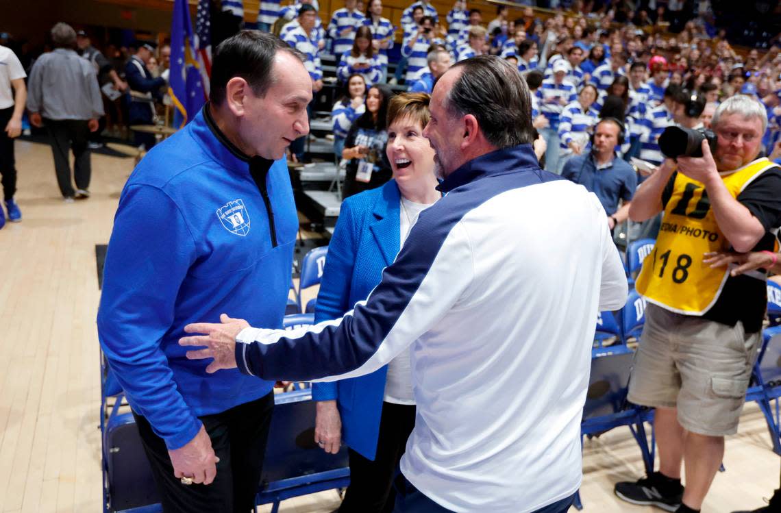 Former Duke head coach Mike Krzyzewski and his wife, Mickie, laugh with Notre Dame head coach Mike Brey before Duke’s game against Notre Dame at Cameron Indoor Stadium in Durham, N.C., Tuesday, Feb. 14, 2023.