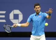 Sep 6, 2016; New York, NY, USA; Novak Djokovic of Serbia hits a shot to Jo-Wilfried Tsonga of France on day nine of the 2016 U.S. Open tennis tournament at USTA Billie Jean King National Tennis Center. Mandatory Credit: Jerry Lai-USA TODAY Sports