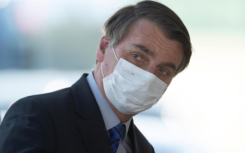 Brazilian President Jair Bolsonaro leaves the Palacio do Alvorada, headquarters of the presidency, in Brasilia, Brazil, 02 June - Shutterstock