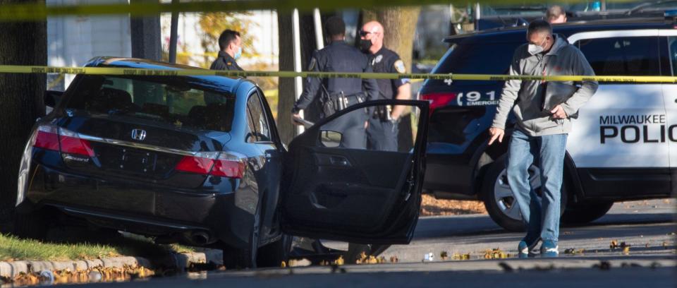 Law enforcement personnel investigate a crime scene in October, 2020 near N. 40th St. and W. Custer Ave. in Milwaukee.