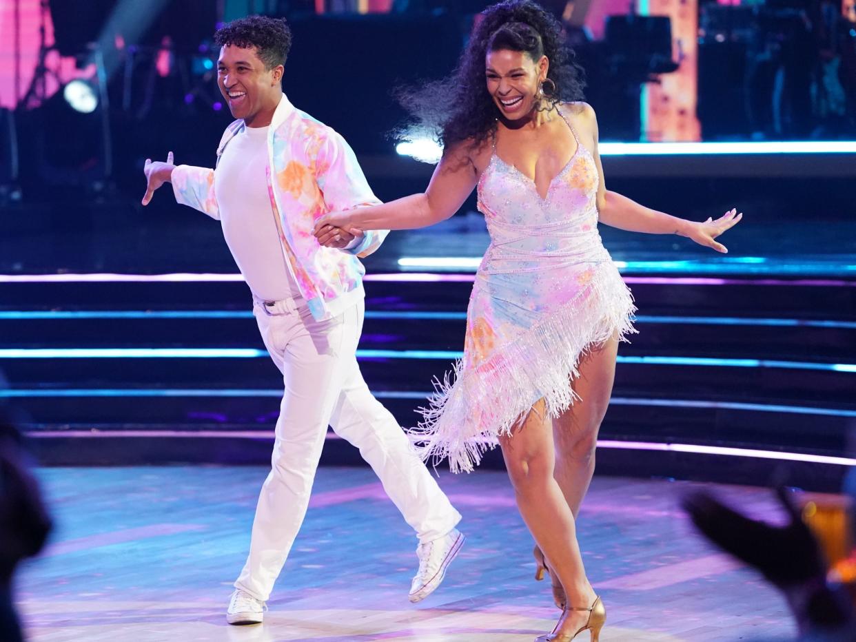 Brandon Armstrong and Jordin Sparks, both in white, perform during the season 31 premiere of "Dancing With the Stars."