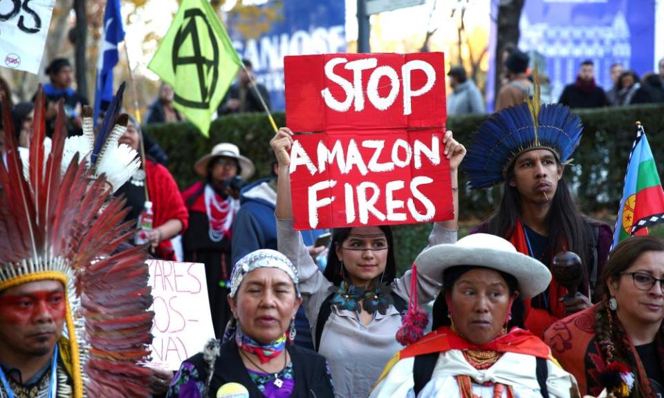 South American indigenous people attend a protest demanding action against climate change in Madrid, during the COP25 Climate Summit on Friday.