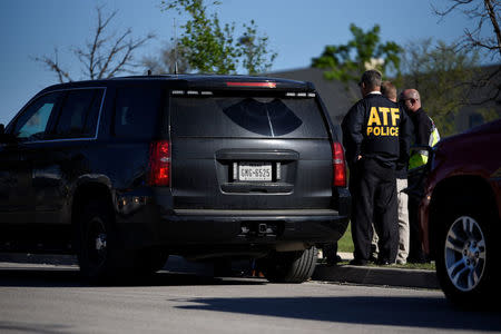 Law enforcement personnel attend the scene of a blast at a FedEx facility in Schertz, Texas, U.S., March 20, 2018. REUTERS/Sergio Flores