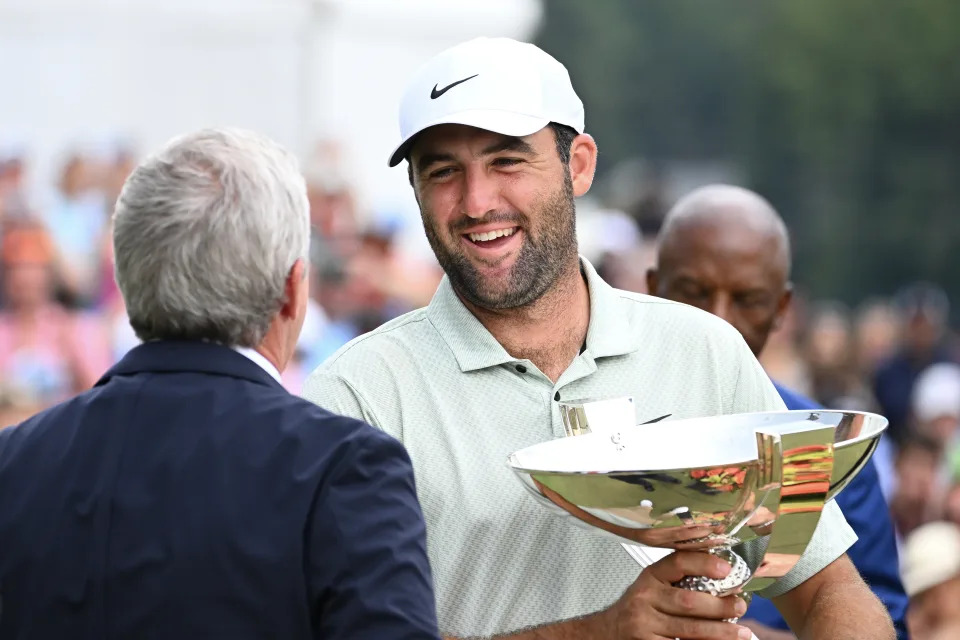  PGA TOUR Commissioner Jay Monahan awards Scottie Scheffler of the United States the FedEx Cup after winning the TOUR Championship at East Lake Golf Club on September 01, 2024 in Atlanta, Georgia. (Photo by Tracy Wilcox/PGA TOUR via Getty Images)