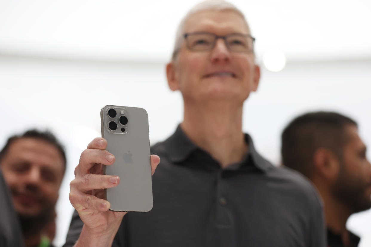 CUPERTINO, CALIFORNIA - SEPTEMBER 12:  Apple CEO Tim Cook holds up a new iPhone 15 Pro during an Apple event on September 12, 2023 in Cupertino, California. Apple revealed its lineup of the latest iPhone 15 versions as well as other product upgrades during the event. (Photo by Justin Sullivan/Getty Images)