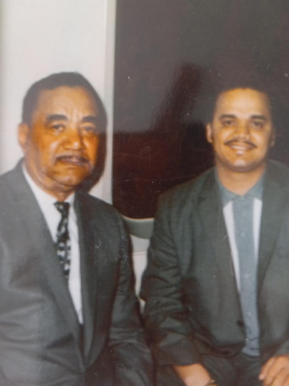 A young Raymond Martinez, shown at right, poses with his father in this old family photo.