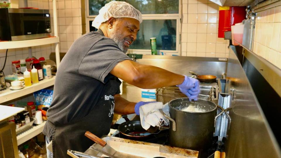Lawrence “Bono” Isom, shown Dec. 15, 2022, stirs a pot of smooth grits at Rock Inn Restaurant, which recently reopened at 2112 Second Ave. E., Palmetto. Whatever the dish, the secret ingredient is love, says the family that operates the restaurant.