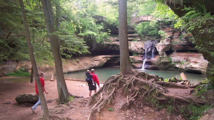 hikers approach waterfall