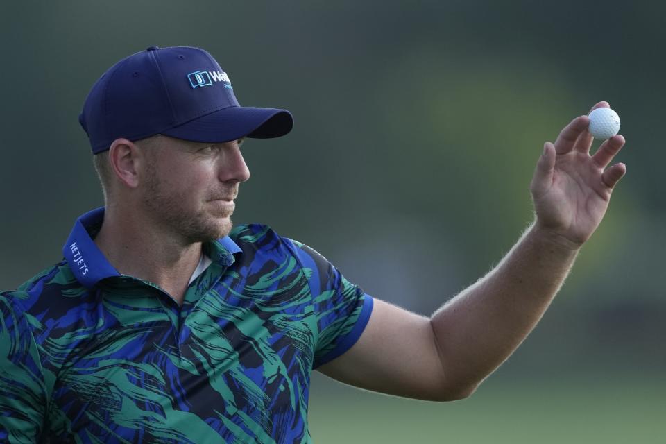 Matt Wallace of England reacts on the 18th hole during the round three of the DP World Tour Championship golf tournament, in Dubai, United Arab Emirates, Saturday, Nov. 18, 2023. (AP Photo/Kamran Jebreili)