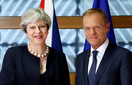 British Prime Minister Theresa May and European Council President Donald Tusk pose during a EU leaders summit in Brussels, Belgium June 22, 2017. REUTERS/Francois Lenoir