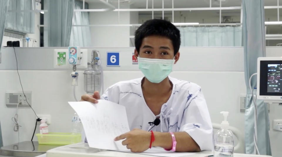 Adul Sam-on, one of the 12 boys rescued from the flooded cave, thanks rescuers from his hospital room at Chiang Rai Prachanukroh Hospital. Source: Chiang Rai Prachanukroh Hospital via AP