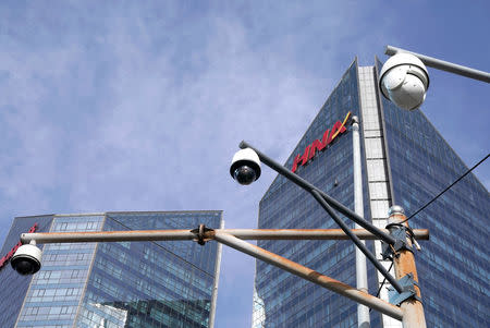 FILE PHOTO: A HNA Group logo is seen on the building of HNA Plaza in Beijing, China February 9, 2018. REUTERS/Jason Lee/File Photo