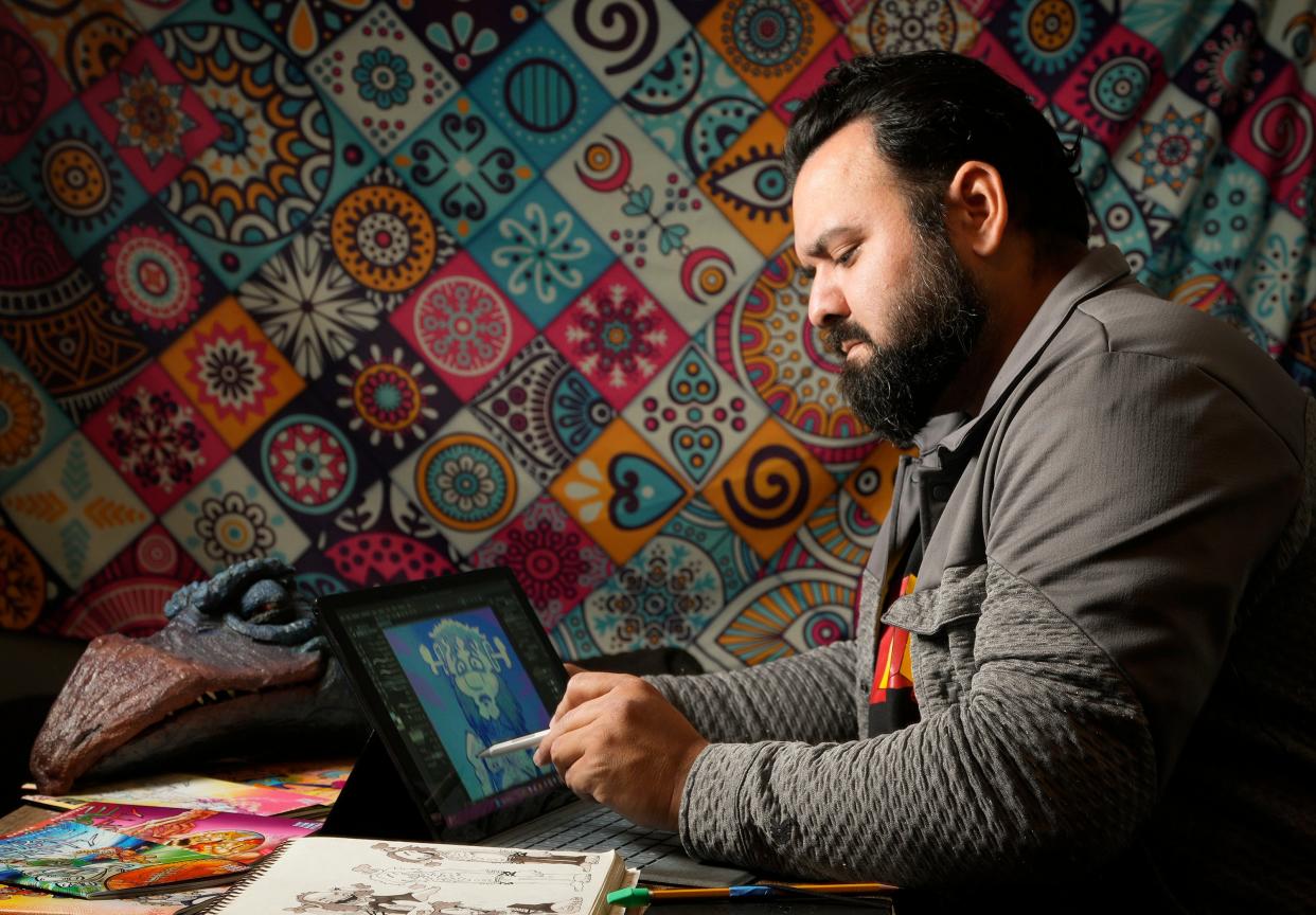 Comic book artist Oscar Garza works at his home on Georgetown on Wednesday November 1, 2023.