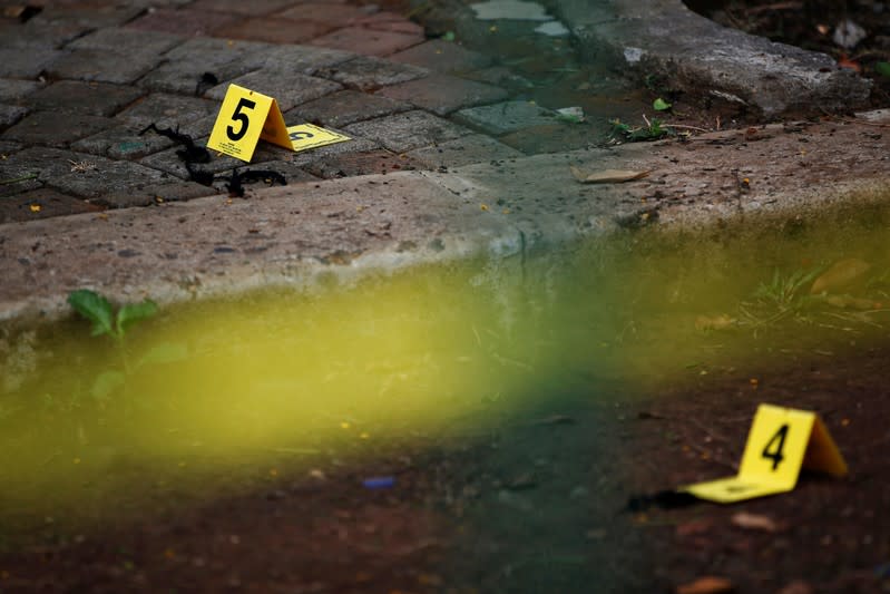 Evidence markers are pictured during an investigation following a blast at National Monument (Monas) complex in Jakarta