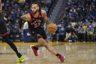 Toronto Raptors guard Gary Trent Jr. (33) dribbles up the court against the Golden State Warriors during the first half of an NBA basketball game in San Francisco, Sunday, Nov. 21, 2021. (AP Photo/Jeff Chiu)