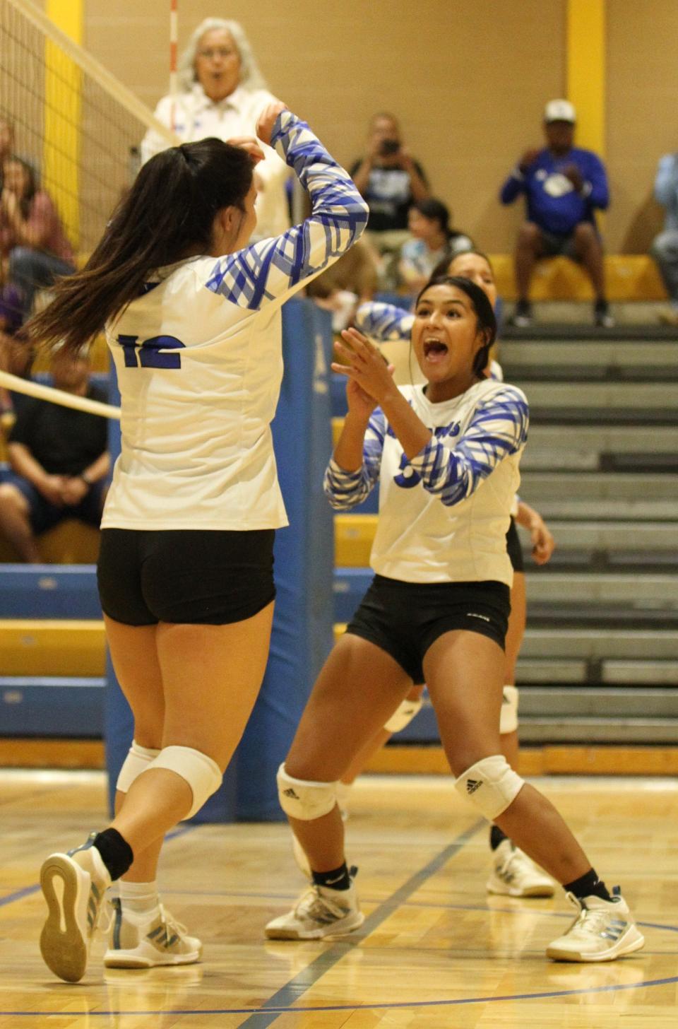 San Angelo Lake View's Skylar Lacy, right, celebrates with Emma Guevara, left, after a successful point at the Nita Vannoy Memorial Volleyball Tournament Saturday, Aug. 20, 2022, at Lincoln Middle School.