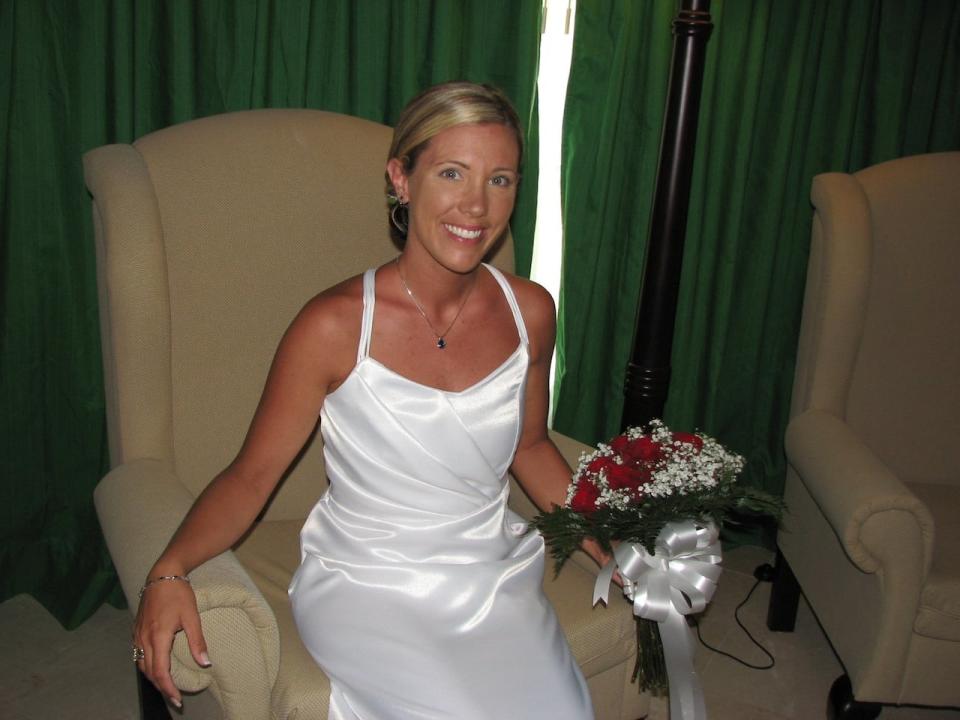 Charette pictured in her original wedding dress that was hand made by her mother-in-law back in 2008. 