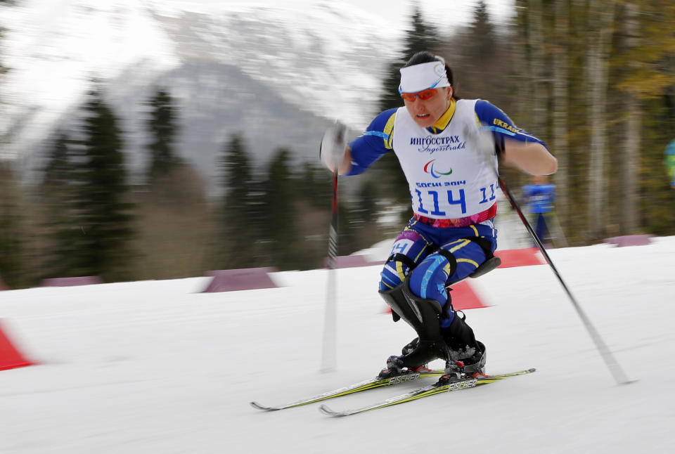 Lyudmyla Pavlenko of Ukraine races to win the ladies 12km cross country ski, sitting event at the 2014 Winter Paralympic, Sunday, March 9, 2014, in Krasnaya Polyana, Russia. (AP Photo/Dmitry Lovetsky)