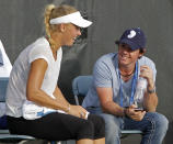 Second-ranked golfer Rory McIlroy and top-ranked tennis player Caroline Wozniacki met at a heavyweight boxing match in July, and they've been a hot item since. (AP Photo/Al Behrman)