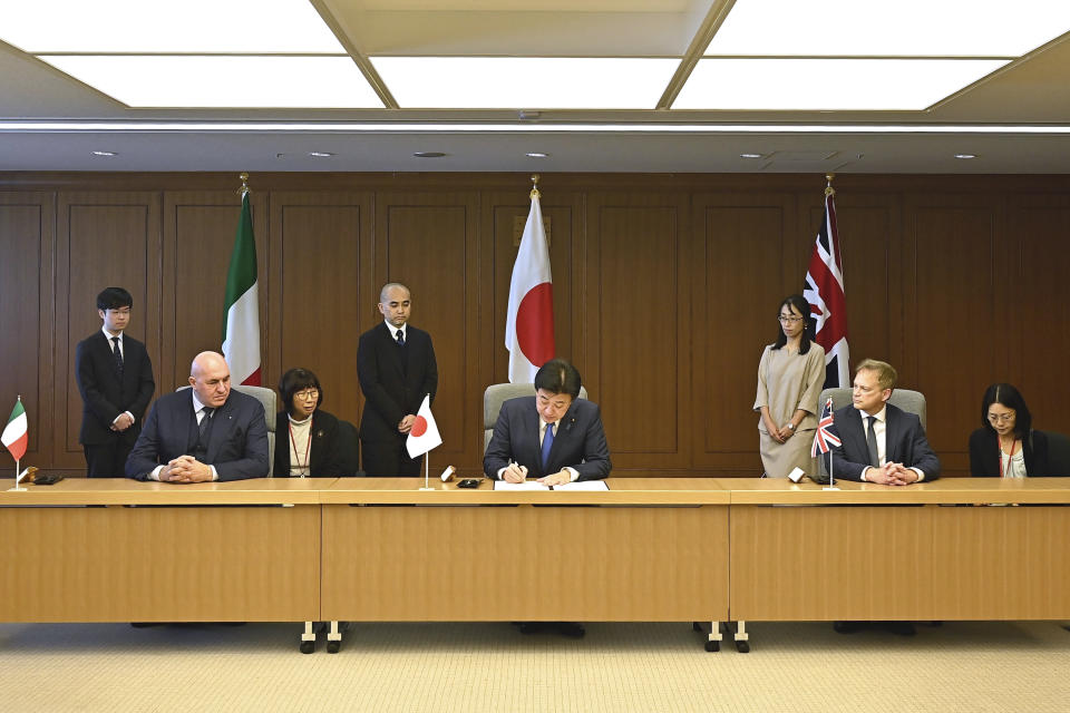 Britain's Defense Minister Grant Shapps, right, Italy's Defense Minister Guido Crosetto, left, and Japanese Defense Minister Minoru Kihara, center, attend a signing ceremony for Global Combat Air Programme (GCAP) at the defense ministry Thursday, Dec. 14, 2023, in Tokyo, Japan. (David Mareuil/Pool Photo via AP)