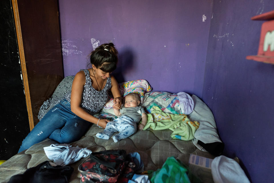 Luli, 19, plays with her son at her home in Villa 31, a populous and marginalised shantytown neighbourhood in Buenos Aires, Argentina, March 29, 2019. Luli has gone through a year of treatment since contracting the disease while she was pregnant. She says her now months-old baby luckily did not get infected. Luli lives in a flat with one bedroom, a kitchen and no bathroom together with her son and partner. The three sleep in one room. "We are constantly moving fromone house to another because of the high price of the rent," she said. (Photo: Magali Druscovich/Reuters)