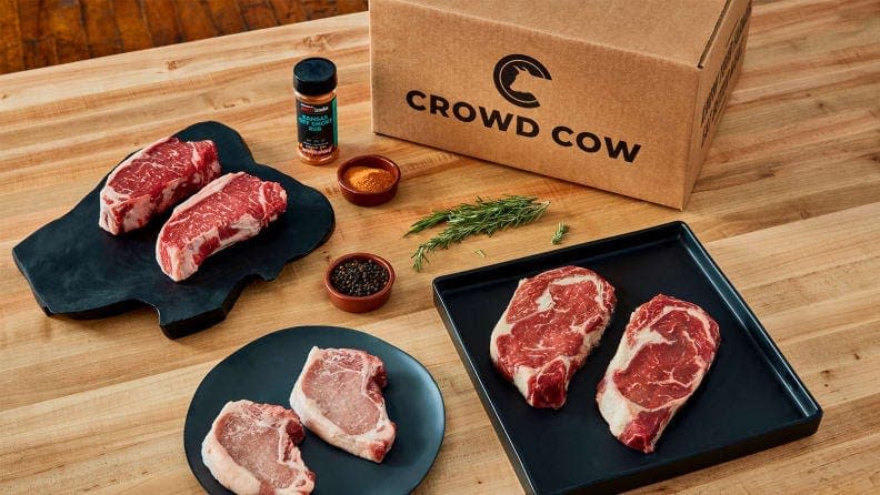 Slabs of beef and a Crowd Cow meal box.