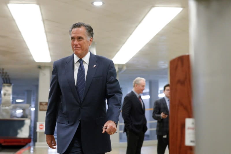 Senator Romney walks to board an elevator at the U.S. Capitol, ahead of a series of votes on response for the coronavirus disease (COVID-19), on Capitol Hill in Washington