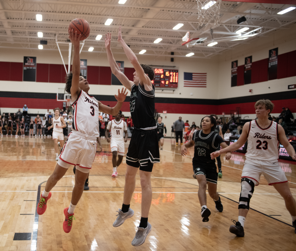 Cooper Carnahan on defense against Roosevelt's Jeremiah Lepp.