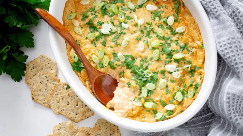 Clam dip with green onions and crackers