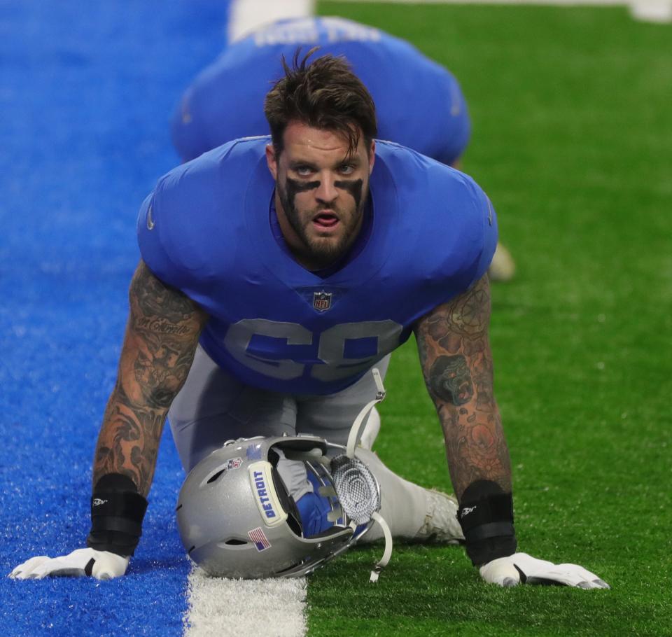 Lions offensive tackle Taylor Decker warms up before the game against the Houston Texans at Ford Field on Thursday, Nov. 26, 2020.