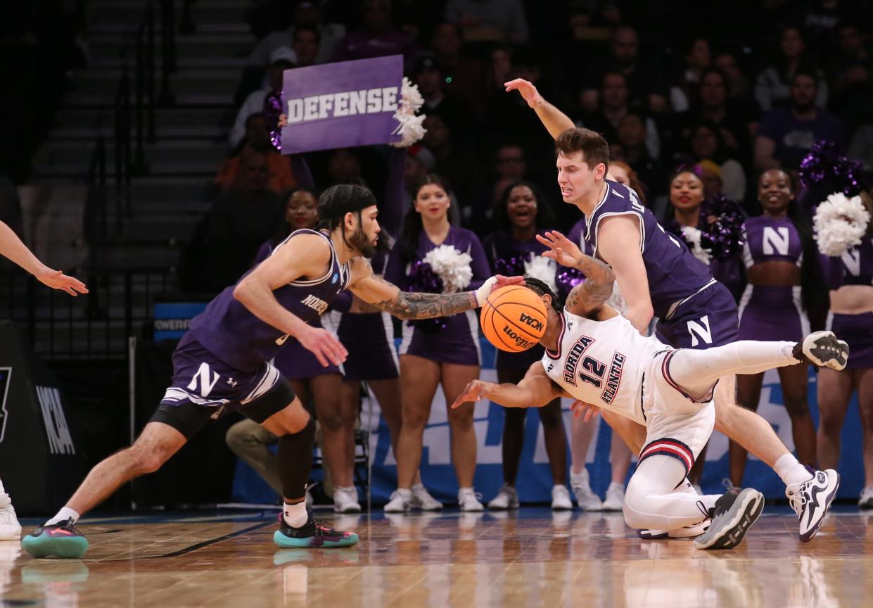 Florida Atlantic guard Jalen Gaffney (12) fights for a loose ball against Northwestern during the first round of the 2024 NCAA men's tournament at the Barclays Center.