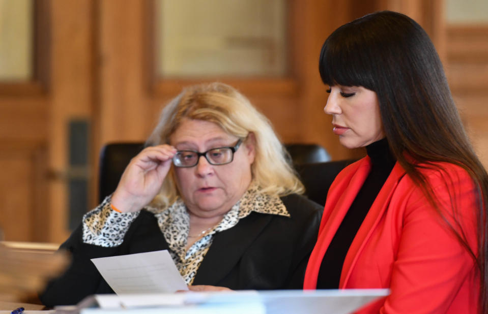 Brenda Tracy, right, and attorney Karen Truszkowski look over a revised agreement between Tracy and former MSU football coach Mel Tucker's legal team during her appearance in front of Judge Rosemarie Aquilina at the Ingham County Circuit Court in downtown Mason, Thursday, Oct. 26, 2023. Tucker did not appear.