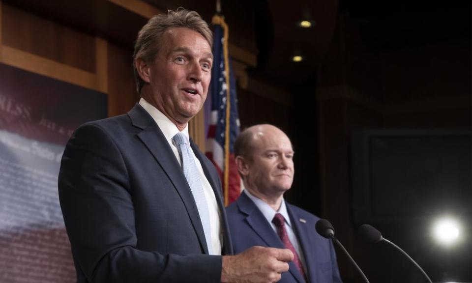 Sentor Jeff Flake, pictured with his Democratic colleague Senator Chris Coons, wants a vote on his bill to protect the special counsel’s investigation into Russian meddling in the 2016 election.