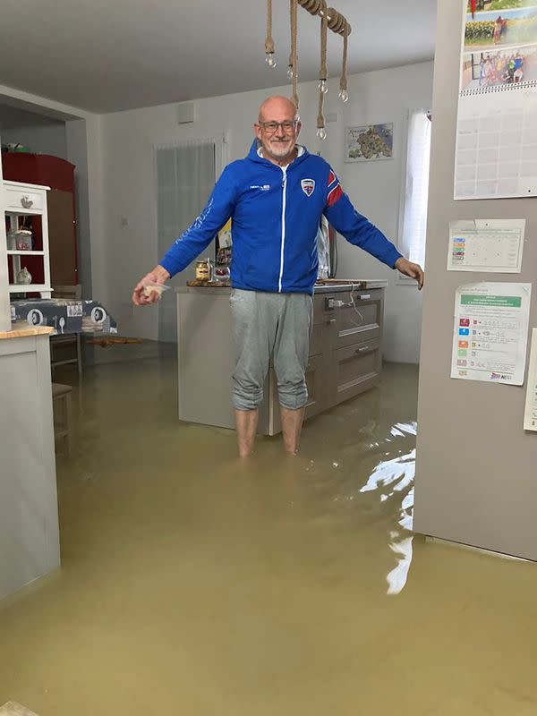 Farm owner Mongardi stands in his flooded living room in Lugo di Ravenna
