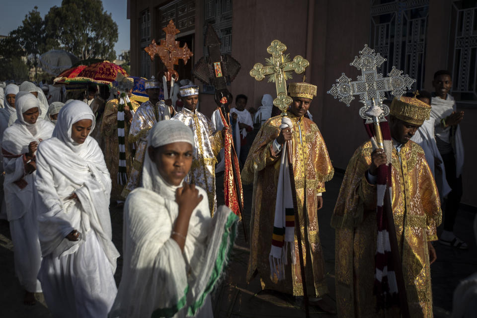 Priests from the Ethiopian Orthodox Tewahedo Church lead the procession during a Sunday morning service at the Church of St. Mary in Mekele, in the Tigray region of northern Ethiopia Sunday, May 9, 2021. The head of the Ethiopian Orthodox Church, Patriarch Abune Mathias, in a video shot last month on a mobile phone and carried out of Ethiopia, sharply criticized Ethiopia's actions in the conflict in the country's Tigray region. (AP Photo/Ben Curtis)