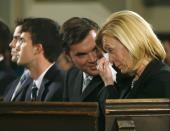 The wife of Canada's former finance minister Jim Flaherty, Christine Elliott (R) and his sons attend his state funeral in Toronto, April 16, 2014. REUTERS/Mark Blinch (CANADA - Tags: POLITICS OBITUARY)