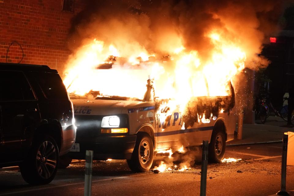 An NYPD van burning after it was set on fire by protesters during a chaotic protest over the death of George Floyd in New York, NY on May 30, 2020. (Photo/Christopher Sadowski)