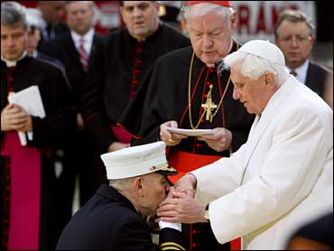 New York City Fire Department Chief Salvatore Cassano kisses the hand of Pope Benedict XVI as he visits the site of the Sept. 11, 2001, terrorist attacks on the World Trade Center, in New York, April 20, 2008. / Credit: AP Photo/Todd Heisler