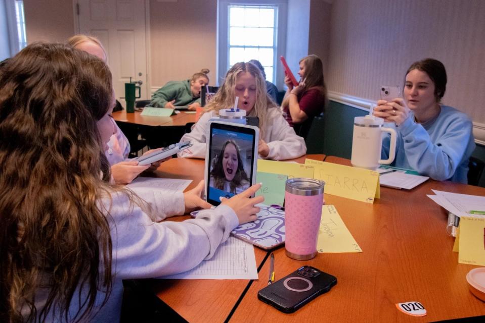 Future teachers in Robin Fuxa’s class at Oklahoma State University record their mouth shapes while forming words.