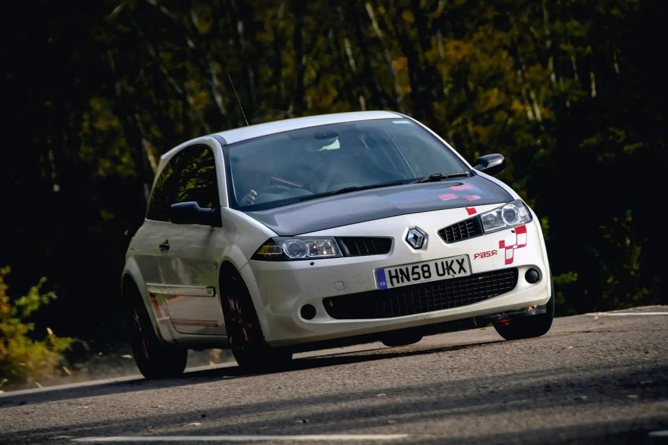 <p>By adding a roll cage and a carbon fibre bonnet, replacing the rear windows with polycarbonate, removing the rear seats, and removing the radio and the passenger airbag, Renaultsport managed to shave <strong>123kg </strong>from the old Megane RS with the R26R. The spring rates, front and rear, were over 10 percent softer while the uprated dampers and springs gave better stability and control through the corners. Renault kept the differential from the normal car but fitted the R26R with Toyo tyres which gave it masses of grip.</p>