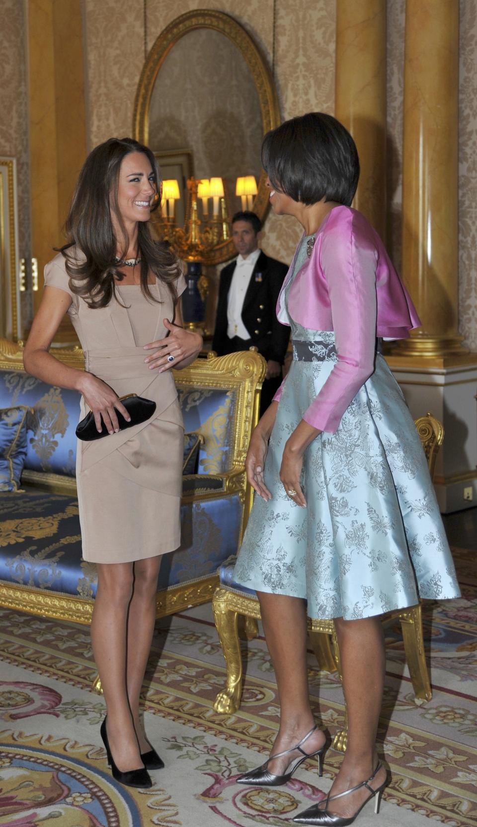 Photo by: (Photo by Toby Melville - WPA Pool/Getty Images)<br>First Lady Michelle Obama greets hosed-up Kate on a visit to Buckingham Palace-<br>Though she's donned hose for certain diplomatic events, the first lady has professed to despising the sheer tights, and it looks like she may have shirked off the unspoken code on a trip to the palace. Kate, however, kept her legs covered in "sheer elegance".