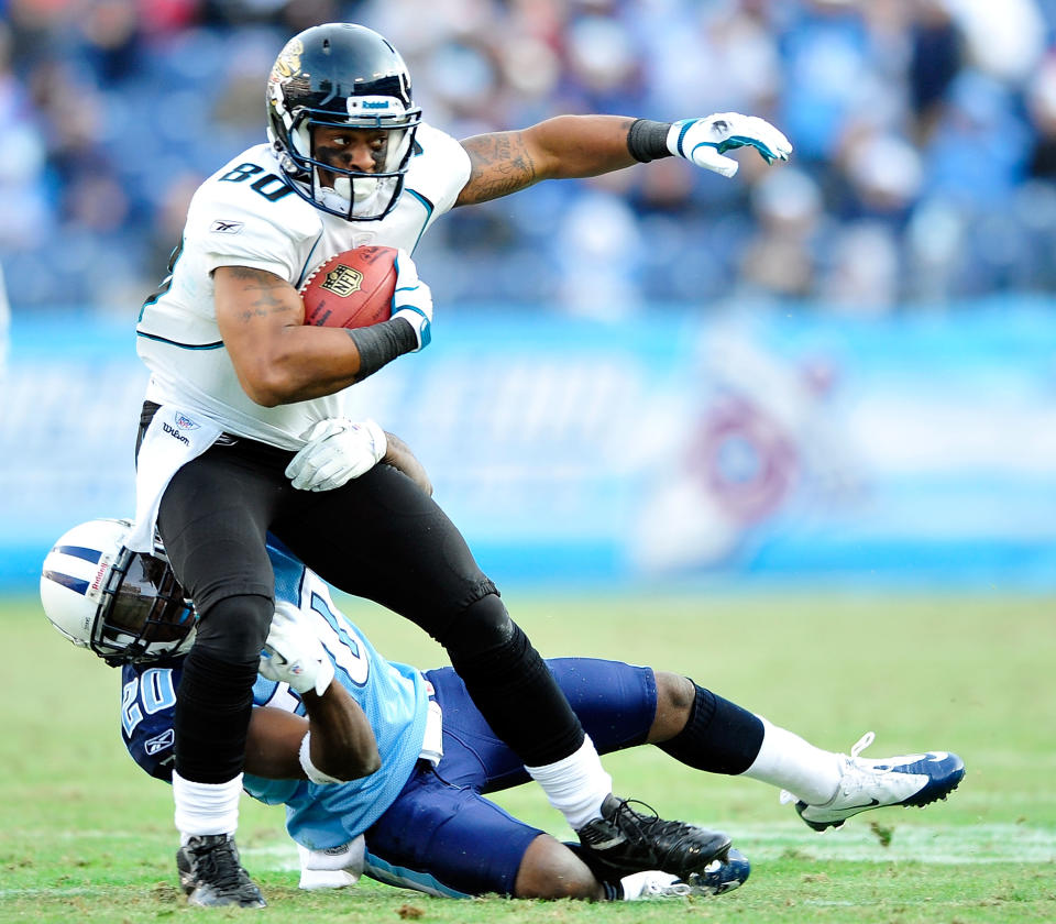 Alterraun Verner #20 of the Tennessee Titans tackles Mike Thomas #80 of the Jacksonville Jaguars during play at LP Field on December 24, 2011 in Nashville, Tennessee. The Titans won 23-17. (Photo by Grant Halverson/Getty Images)