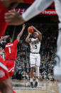 Michigan State's Cassius Winston (5) shoots against Ohio State's Luther Muhammad (1) during the second half of an NCAA college basketball game, Sunday, March 8, 2020, in East Lansing, Mich. (AP Photo/Al Goldis)